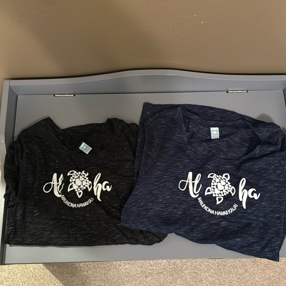 2 Hawaii t shirts one black and one blue